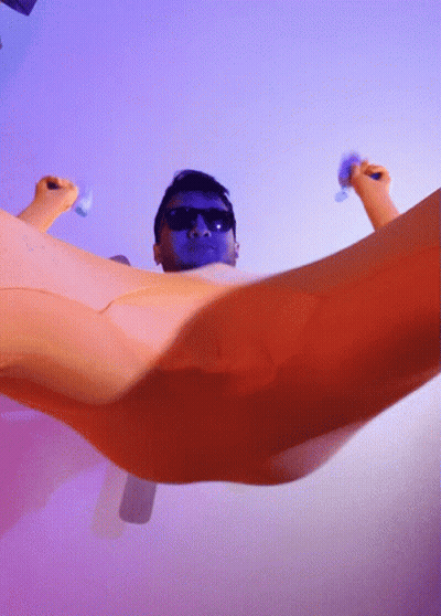 Man With Sunglasses And Blue Face Laying In Bathtub GIF