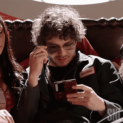 Man With Sunglasses And Custodian Name Tag On Phone GIF