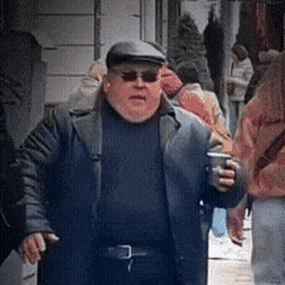 Man With Sunglasses And Hat Walking Holding Coffee GIF