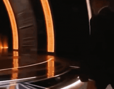 Man With Sunglasses And Headphones Mic In Front Of Crowd GIF
