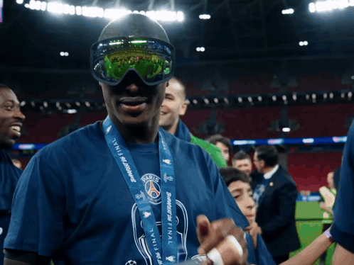 Man With Sunglasses And Medal Saying Paris GIF