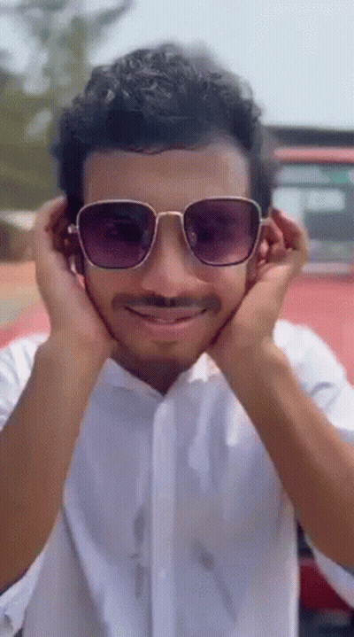 Man With Sunglasses And Mustache Covering Ears GIF
