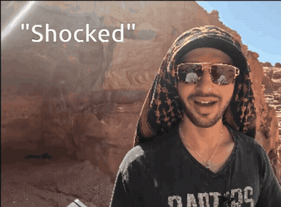 Man With Sunglasses And Scarf Says Shocked GIF