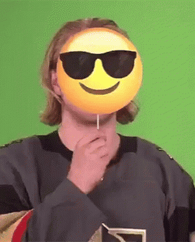 Man With Sunglasses And Smiley Mask Holding Lollipop GIF