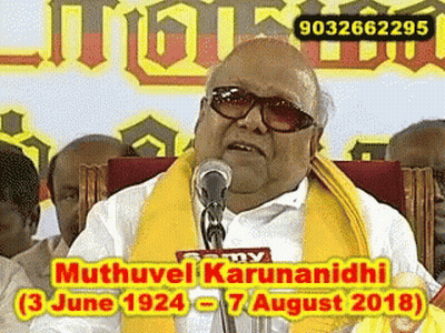 Man With Sunglasses And Yellow Scarf Giving Speech GIF