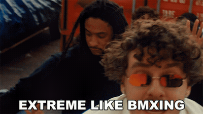 Man With Sunglasses Extreme Like BMXing Next To Another Man GIF