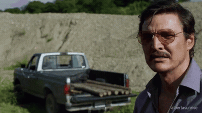 Man With Sunglasses In Front Of Truck With Logs GIF