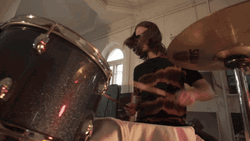 Man With Sunglasses Playing Drum GIF