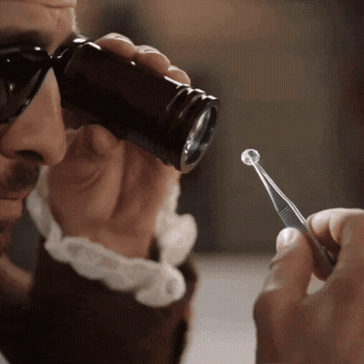 Man With Sunglasses Using Magnifying Glass GIF