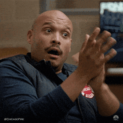 Man With Surprised Look Clapping GIF