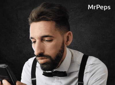 Man With Suspenders And Bow Tie Looking At Phone GIF