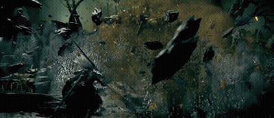 Man With Sword In Cemetery Surrounded By Zombies GIF