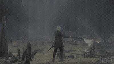 Man With Sword In Field With Flag GIF
