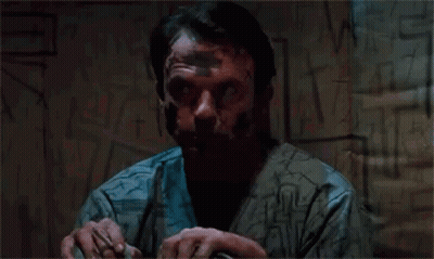 Man With Tape On Face By Graffiti Wall GIF