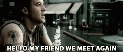 Man With Tattoo Holding Stick In Flooded Street GIF