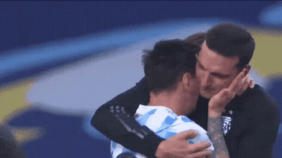 Man With Tattoo Hugging Soccer Player GIF