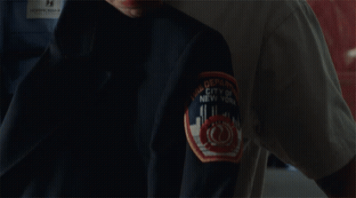 Man With Tattoo Smelling Black Jacket GIF