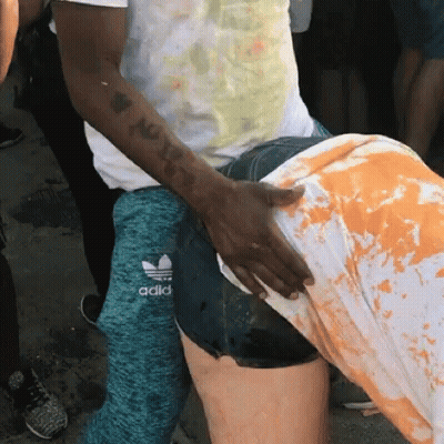 Man With Tattoo Touching Woman's Butt In Adidas Shorts GIF