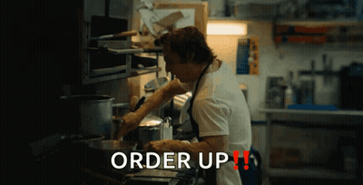 Man With Tattoo 'Zz' Wearing Apron GIF