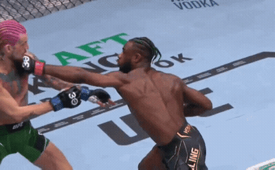 Man With Tattooed Chest In UFC Glove GIF