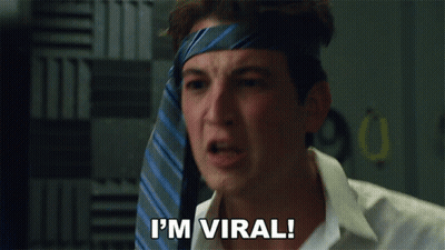 Man With Tie On Head Saying I'm Viral GIF