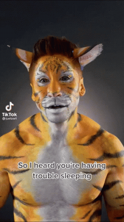 Man With Tiger Face Paint GIF