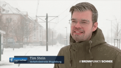 Man With Tim Stein On Jacket GIF