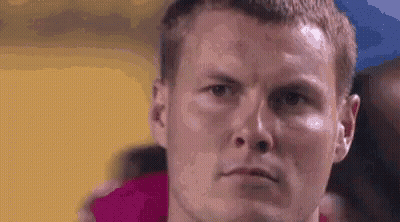 Man With Towel Around Neck Looking At Camera GIF