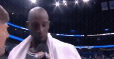 Man With Towel At Microphone In Boxing Ring GIF