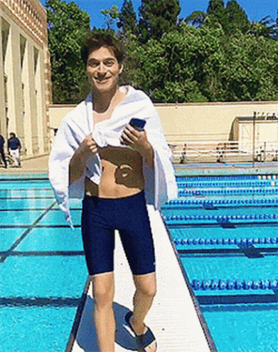 Man With Towel On Diving Board At Pool GIF