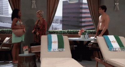Man With Towel Saying Mic In Front Of Two Lounge Chairs GIF