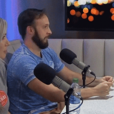 Man With Two Microphones And Bottle Of Water GIF