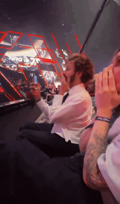 Man With Valorem Wristband Sitting In Stadium GIF