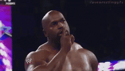 Man With W Logo On Arm In Dark Room GIF