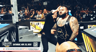 Man With W Logo Shirt At Wrestling Event GIF
