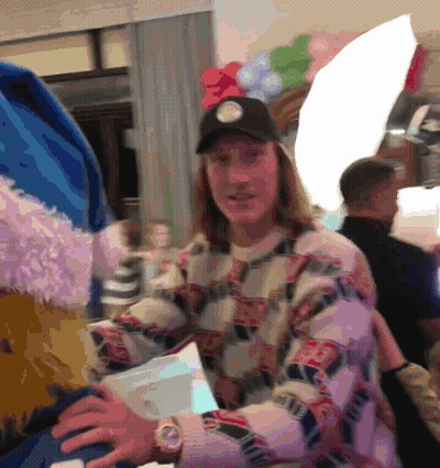 Man With Watch And Hat In Balloon Room GIF
