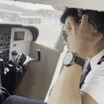 Man With Watch And Headphones In Airplane GIF