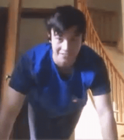Man With Watch Holding Gun GIF