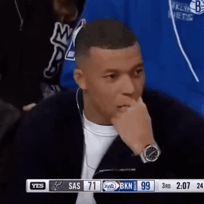 Man With Watch Sitting In Front Of TV GIF