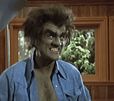 Man With Werewolf Makeup And Blue Shirt GIF