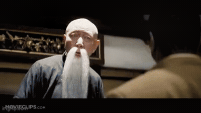 Man With White Beard Talking To Another Man GIF