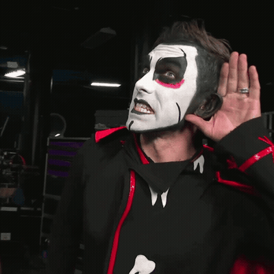 Man With White Face Paint In Black And Red Jacket GIF