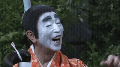 Man With White Face Paint In Kimono GIF