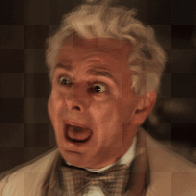 Man With White Hair And Bow Tie Making Funny Face GIF