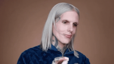 Man With White Hair And Face Tattoo In Blue Jacket GIF