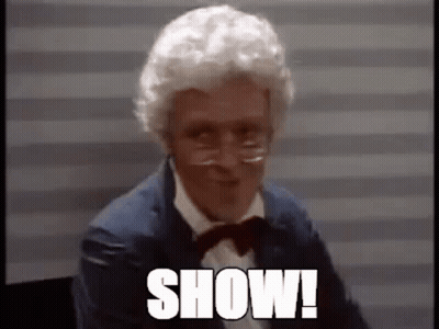 Man With White Hair And Glasses In Suit And Bow Tie Saying Show GIF