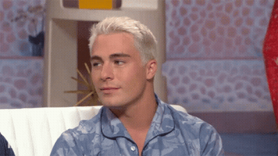 Man With White Hair Sitting On Couch GIF