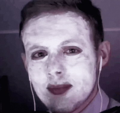 Man With White Mask Wearing Earbuds GIF