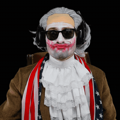 Man With White Paint On Face Wearing Headphones And American Flag Scarf GIF