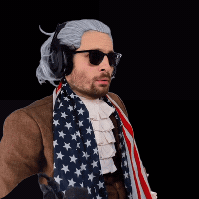 Man With Wig And Sunglasses Holding American Flag GIF